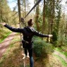 Woman on Treetop Challenge at Go Ape Aberfoyle